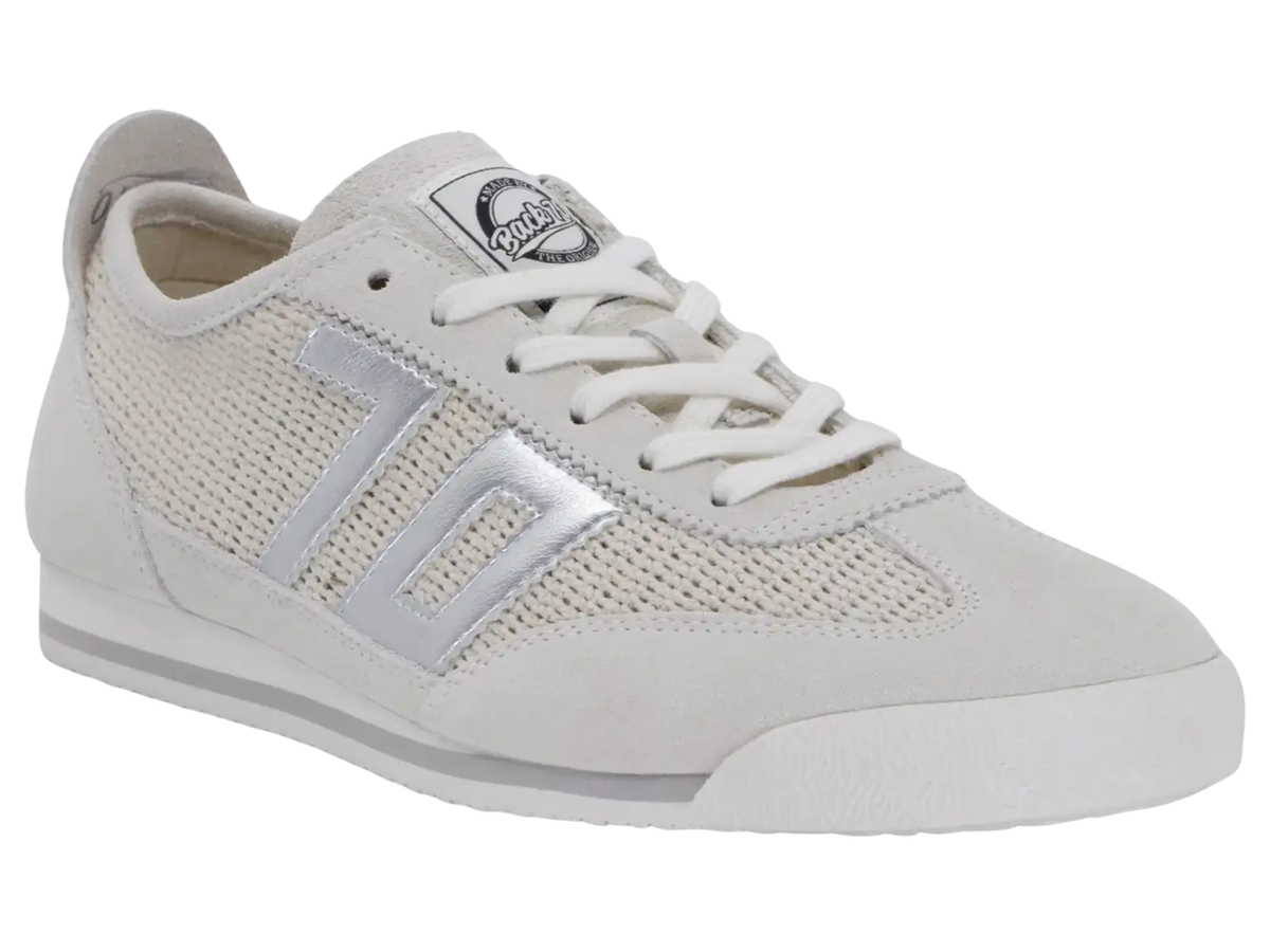 A white low-top sneaker with a textured mesh upper, white laces, and a metallic silver side stripe, shown against a plain white background.
