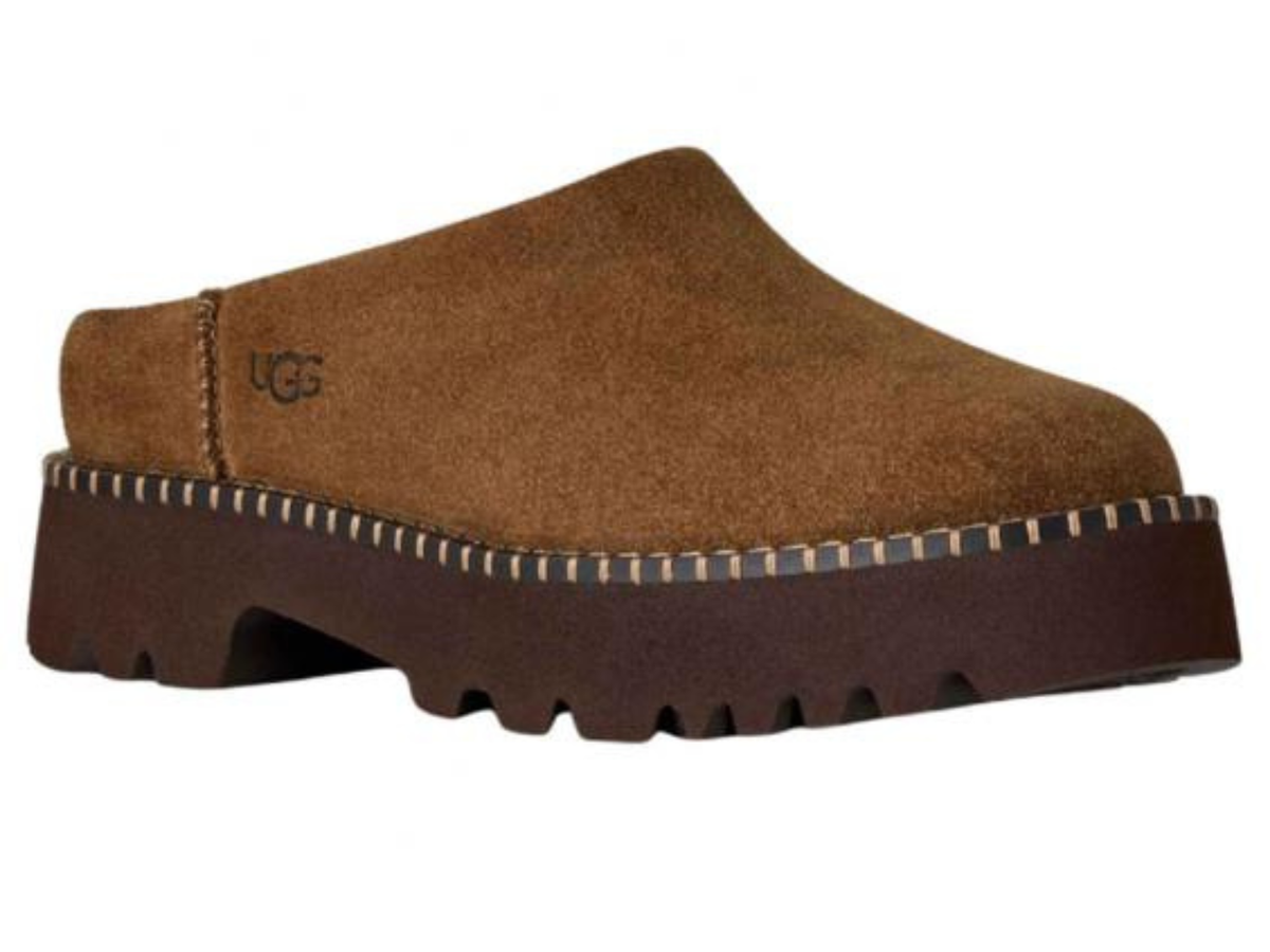A single brown suede clog-style shoe with a chunky dark brown lug sole and a visible UGG logo on the side, shown against a plain white background.