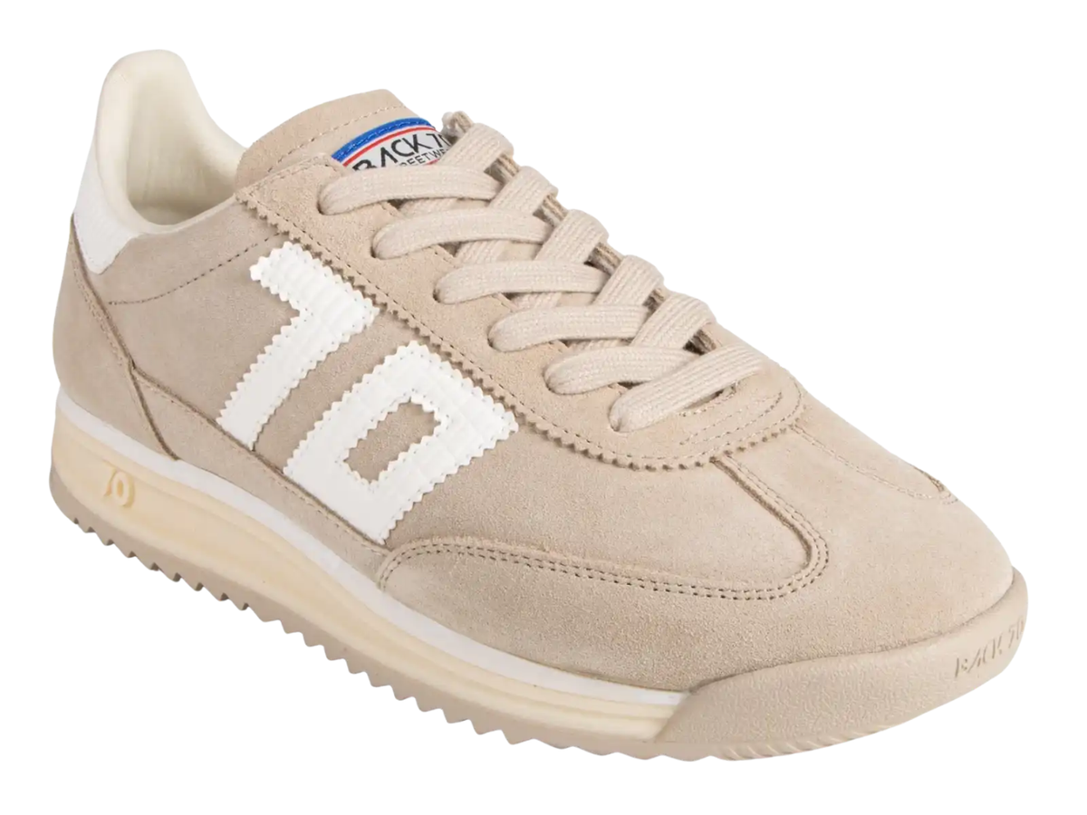 A beige suede sneaker with a large white '10' logo on the side, beige laces, and a cream-colored sole, shown on a plain white background.