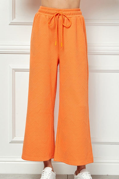 Giving Texture Pant in Orange - J. Cole ShoesSEE AND BE SEENGiving Texture Pant in Orange